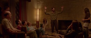 Movie still from “The Invitation” (2015), directed by Karyn Kusama – A group of people sitting in a living room; Wide shot, Low angle