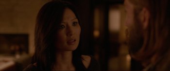 Movie still from “The Invitation” (2015), directed by Karyn Kusama – A person in a dark room; Close Up shot, Over the shoulder angle