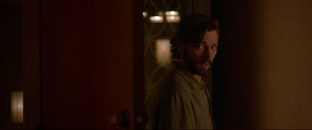 Movie still from “The Invitation” (2015), directed by Karyn Kusama – A person with a beard; Medium shot, Over the shoulder angle