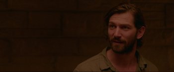 Movie still from “The Invitation” (2015), directed by Karyn Kusama – A person with a beard; Close Up shot, Over the shoulder angle