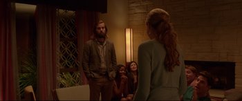 Movie still from “The Invitation” (2015), directed by Karyn Kusama – A group of people sitting in front of a mirror; Medium shot, Over the shoulder angle