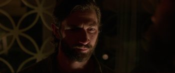 Movie still from “The Invitation” (2015), directed by Karyn Kusama – A person with a beard looking at the camera; Close Up shot, Over the shoulder angle