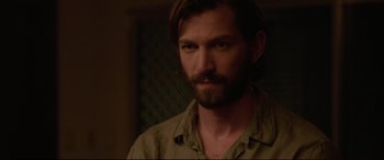 Movie still from “The Invitation” (2015), directed by Karyn Kusama – A person with a beard; Close Up shot, Over the shoulder angle