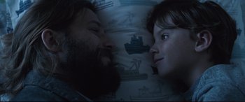 Movie still from “The Invitation” (2015), directed by Karyn Kusama – A man and a woman laying in a bed together; Close Up shot, Overhead angle