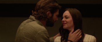 Movie still from “The Invitation” (2015), directed by Karyn Kusama – A man and a woman looking into each others eyes; Close Up shot, Over the shoulder angle