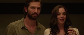 Movie still from “The Invitation” (2015), directed by Karyn Kusama – A man and a woman standing next to each other; Close Up shot, Low angle