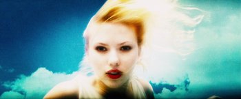 Movie still from “The Island” (2005), directed by Michael Bay – A woman with blonde hair and red lipstick; Close Up shot, Overhead angle