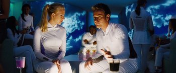 Movie still from “The Island” (2005), directed by Michael Bay – A man and a woman sitting on a couch; Medium shot, Over the shoulder angle