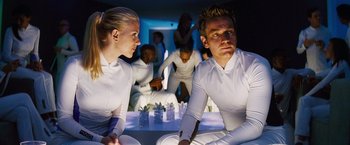 Movie still from “The Island” (2005), directed by Michael Bay – A man and a woman sitting on the ground in a room; Medium shot, Over the shoulder angle