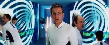 Movie still from “The Island” (2005), directed by Michael Bay – A person wearing a white shirt; Close Up shot, Over the shoulder angle
