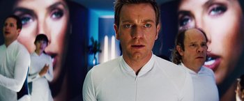 Movie still from “The Island” (2005), directed by Michael Bay – A person wearing a white shirt; Close Up shot, Over the shoulder angle