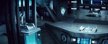 Movie still from “The Island” (2005), directed by Michael Bay – A man walking down a staircase in a building; Extreme Wide shot, High angle