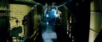 Movie still from “The Island” (2005), directed by Michael Bay – A train tunnel with a number on the side of it; Extreme Wide shot, High angle