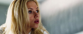 Movie still from “The Island” (2005), directed by Michael Bay – A person with blonde hair and blue eyes; Close Up shot, Low angle