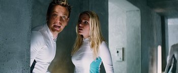 Movie still from “The Island” (2005), directed by Michael Bay – A man and a woman standing next to each other; Medium shot, Low angle