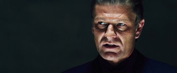 Movie still from “The Island” (2005), directed by Michael Bay – A person wearing a black shirt; Close Up shot, Low angle