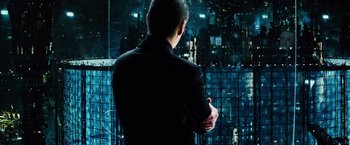 Movie still from “The Island” (2005), directed by Michael Bay – A man standing in front of a window at night; Medium shot, Over the shoulder angle