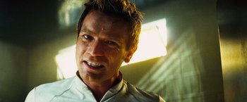 Movie still from “The Island” (2005), directed by Michael Bay – A person wearing a white shirt; Close Up shot, Low angle