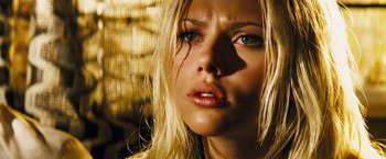 Movie still from “The Island” (2005), directed by Michael Bay – A person with long blonde hair; Close Up shot, Low angle