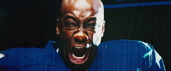 Movie still from “The Island” (2005), directed by Michael Bay – A man's face with his mouth wide open; Extreme Close Up shot, Low angle