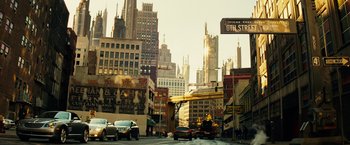 Movie still from “The Island” (2005), directed by Michael Bay – A street scene with cars driving down the road; Extreme Wide shot, Low angle