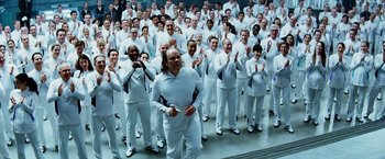Movie still from “The Island” (2005), directed by Michael Bay – A large group of people in white clothes; Wide shot, High angle
