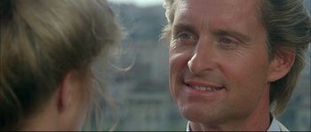 Movie still from “The Jewel of the Nile” (1985), directed by Lewis Teague – A man's face and a woman's face; Close Up shot, Over the shoulder angle