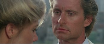 Movie still from “The Jewel of the Nile” (1985), directed by Lewis Teague – A man and a woman looking at each other; Close Up shot, Over the shoulder angle