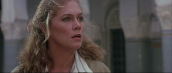 Movie still from “The Jewel of the Nile” (1985), directed by Lewis Teague – A person wearing a jacket; Close Up shot, Low angle