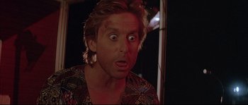 Movie still from “The Jewel of the Nile” (1985), directed by Lewis Teague – A person with a surprised look on their face; Close Up shot, Low angle