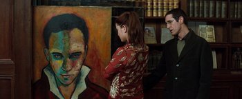 Movie still from “Queen of the Damned” (2002), directed by Michael Rymer – A woman standing next to a man in front of a painting; Medium shot, Over the shoulder angle