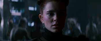 Movie still from “Queen of the Damned” (2002), directed by Michael Rymer – A person wearing a black shirt; Close Up shot, Low angle