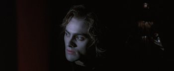 Movie still from “Queen of the Damned” (2002), directed by Michael Rymer – A man with long dark hair is looking into the distance; Close Up shot, Low angle