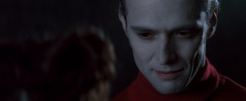 Movie still from “Queen of the Damned” (2002), directed by Michael Rymer – A person wearing a red shirt; Close Up shot, Over the shoulder angle