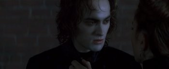 Movie still from “Queen of the Damned” (2002), directed by Michael Rymer – A person with long dark hair; Close Up shot, High angle