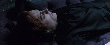 Movie still from “Queen of the Damned” (2002), directed by Michael Rymer – A woman laying down with her eyes closed; Close Up shot, Overhead angle