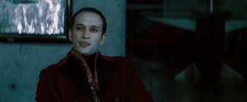 Movie still from “Queen of the Damned” (2002), directed by Michael Rymer – A man in a red jacket is looking at the camera; Close Up shot, High angle