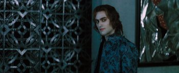 Movie still from “Queen of the Damned” (2002), directed by Michael Rymer – A man with long dark hair wearing a blue shirt; Medium shot, Over the shoulder angle