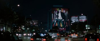 Movie still from “Queen of the Damned” (2002), directed by Michael Rymer – A large billboard on the side of a building; Wide shot, Over the shoulder angle