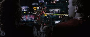 Movie still from “Queen of the Damned” (2002), directed by Michael Rymer – A view of a busy city at night from a car window; Extreme Wide shot, High angle