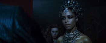 Movie still from “Queen of the Damned” (2002), directed by Michael Rymer – A woman in a silver crown and a woman in a black dress; Close Up shot, Over the shoulder angle