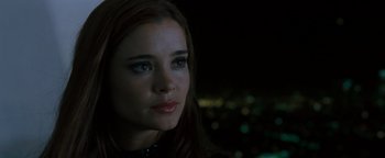 Movie still from “Queen of the Damned” (2002), directed by Michael Rymer – A person with long brown hair; Close Up shot, Over the shoulder angle