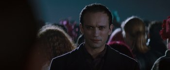 Movie still from “Queen of the Damned” (2002), directed by Michael Rymer – A person wearing a suit and tie; Close Up shot, Low angle