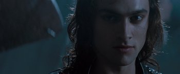 Movie still from “Queen of the Damned” (2002), directed by Michael Rymer – A person with long dark hair; Close Up shot, Low angle