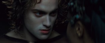 Movie still from “Queen of the Damned” (2002), directed by Michael Rymer – A man's face in the dark; Close Up shot, Over the shoulder angle