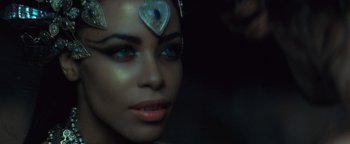 Movie still from “Queen of the Damned” (2002), directed by Michael Rymer – A person wearing makeup with a heart on their forehead; Close Up shot, Overhead angle