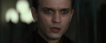 Movie still from “Queen of the Damned” (2002), directed by Michael Rymer – A person with a serious look on his face; Close Up shot, Low angle