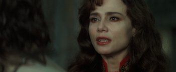 Movie still from “Queen of the Damned” (2002), directed by Michael Rymer – A person with long brown hair; Close Up shot, Over the shoulder angle