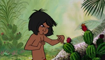 Movie still from “The Jungle Book” (1967), directed by Wolfgang Reitherman – A cartoon of mowgli in the jungle with a prickly pear cactus; Medium shot, Over the shoulder angle