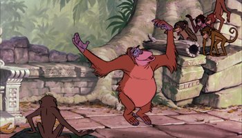 Movie still from “The Jungle Book” (1967), directed by Wolfgang Reitherman – An animated monkey is jumping in the air in front of a tree; Wide shot, Low angle
